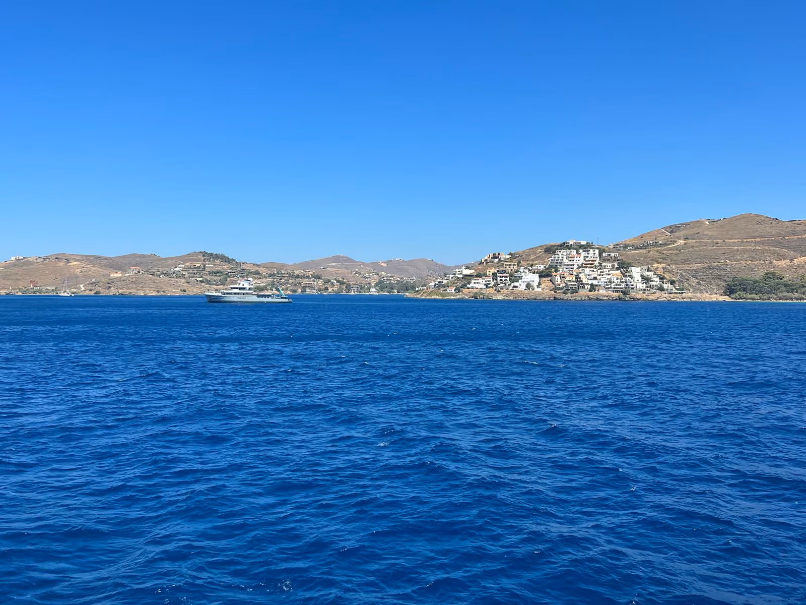 A Kea harbour town across deep blue Aegean water