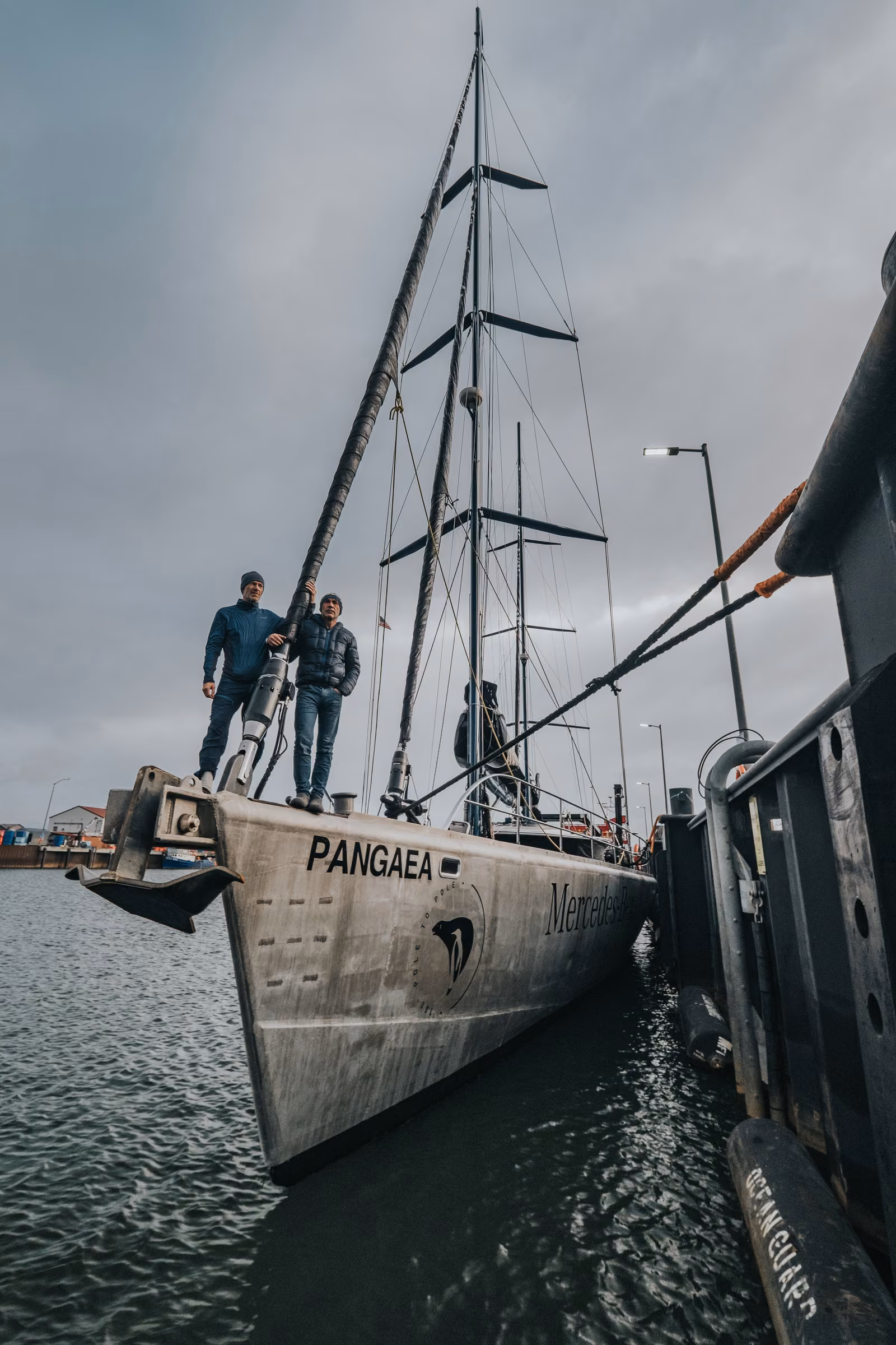 People with a sailboat, sky, Arctic Ocean