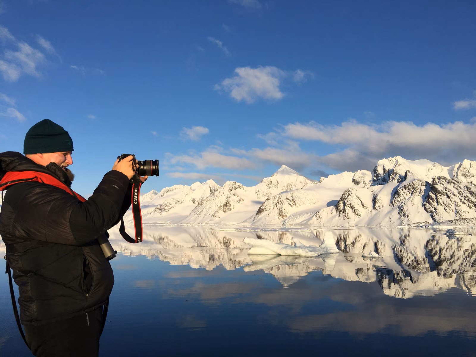 People with sky, snow, Northern fjords, Svalbard