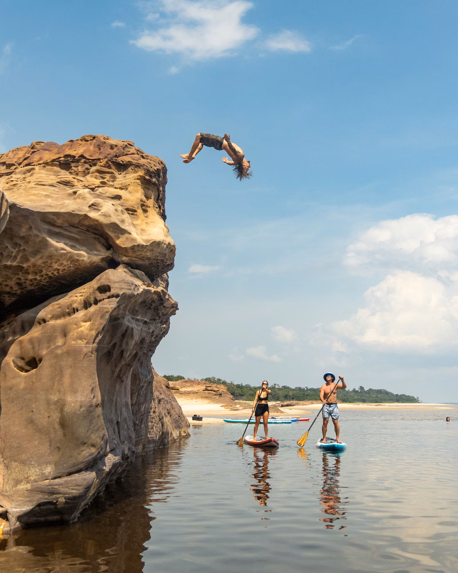 People with sky, rock, Brazilian Amazon