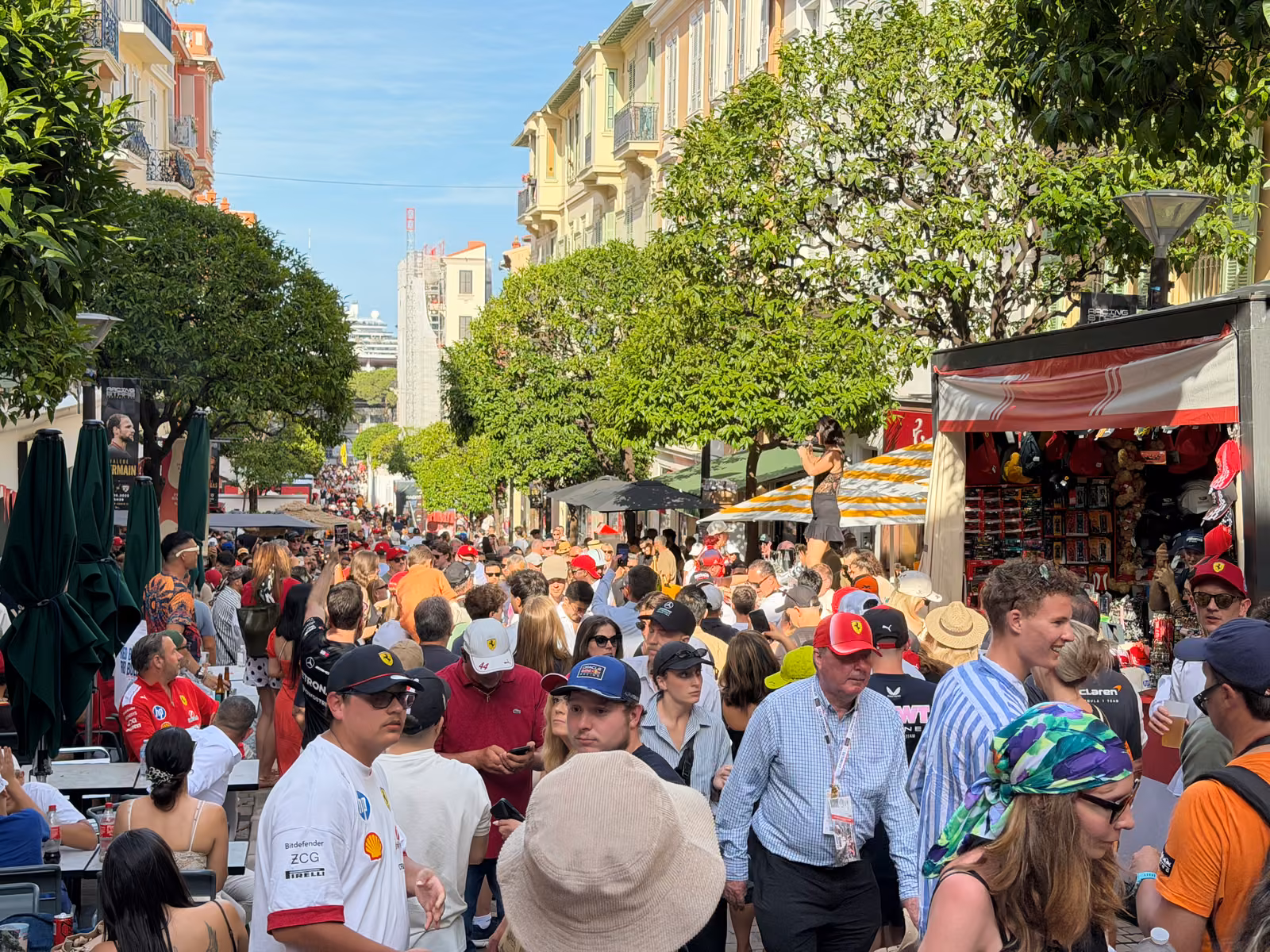 Race crowds filling a Monaco street on Grand Prix weekend