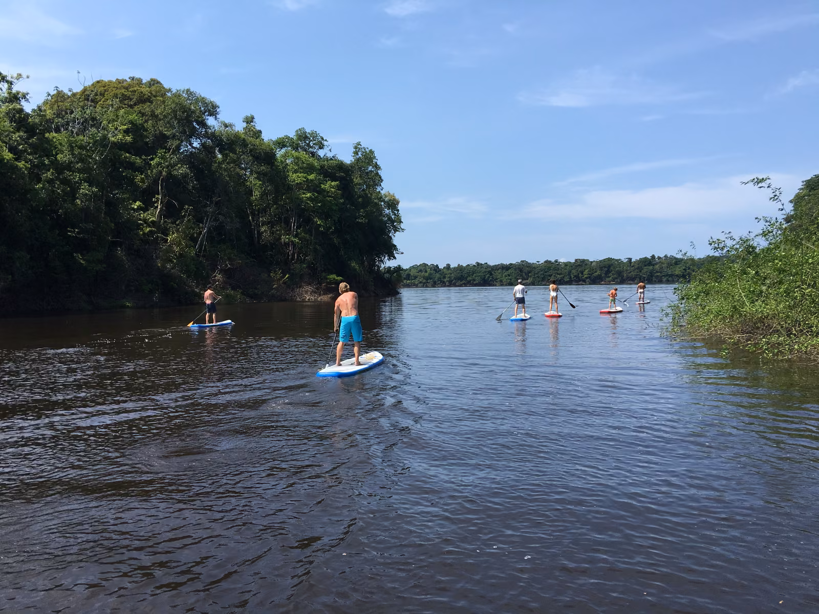 People with sky, open water, Rio Negro, Brazil