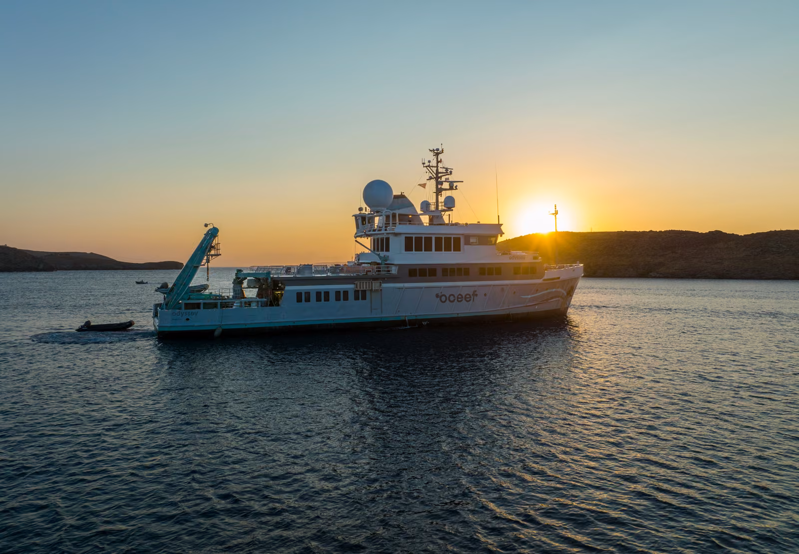 The expedition ship at anchor off Kea at sunset